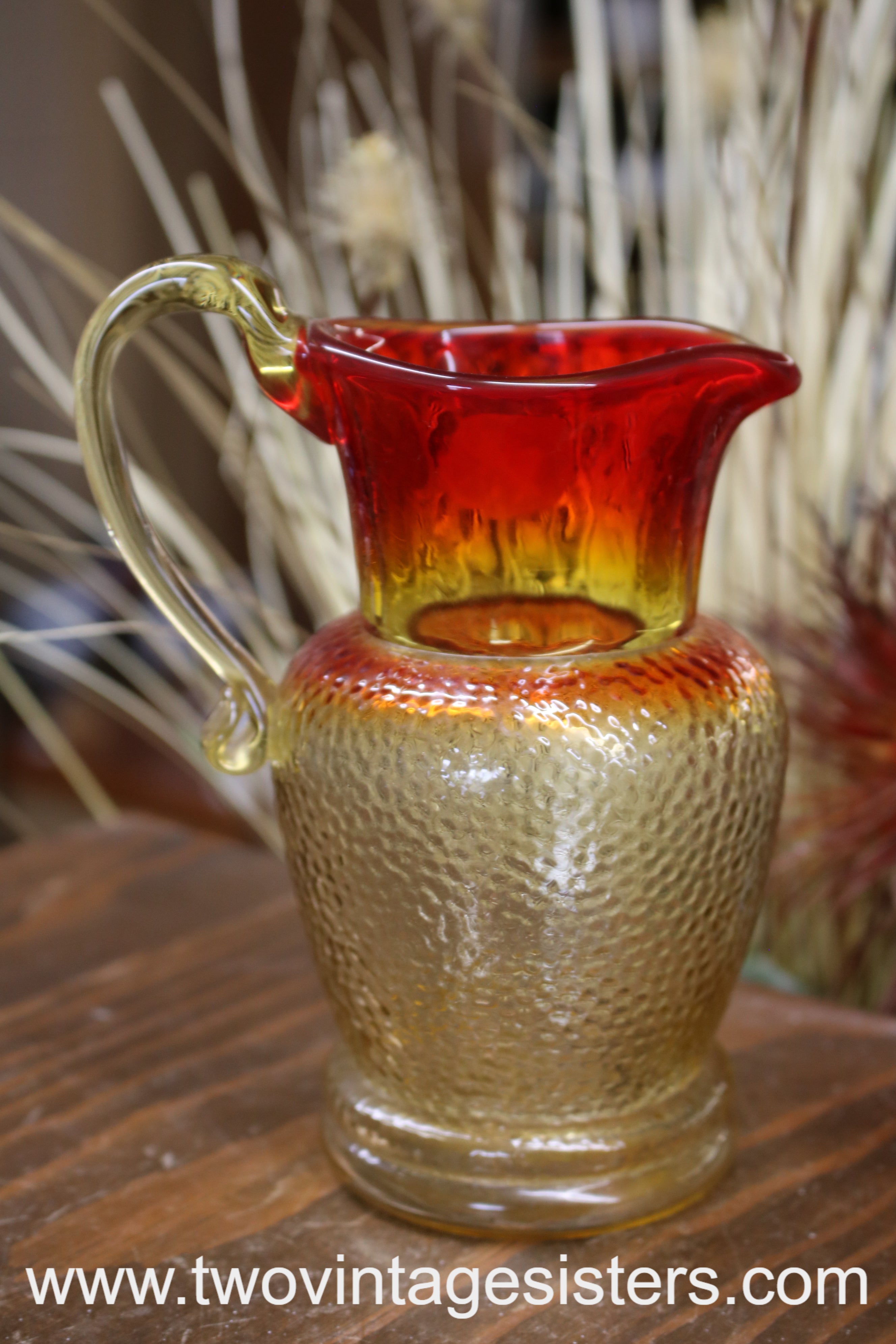 https://www.twovintagesisters.com/cdn/shop/files/Kanawha-Amberina-Glass-Pitcher-VintageGlassArt_3.jpg?v=1684260549