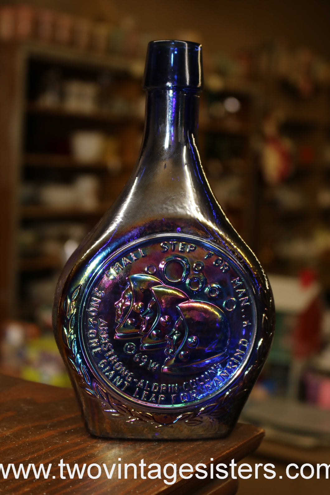 https://www.twovintagesisters.com/cdn/shop/products/Apollo11-CobaltBlueIridescent-MercuryGlassBottle_10_530x@2x.jpg?v=1661383887