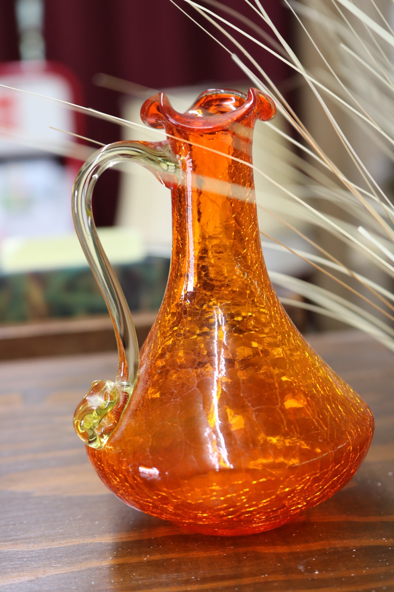 A Small Clear Crackled Amber Hand Blown Glass Pitcher With a