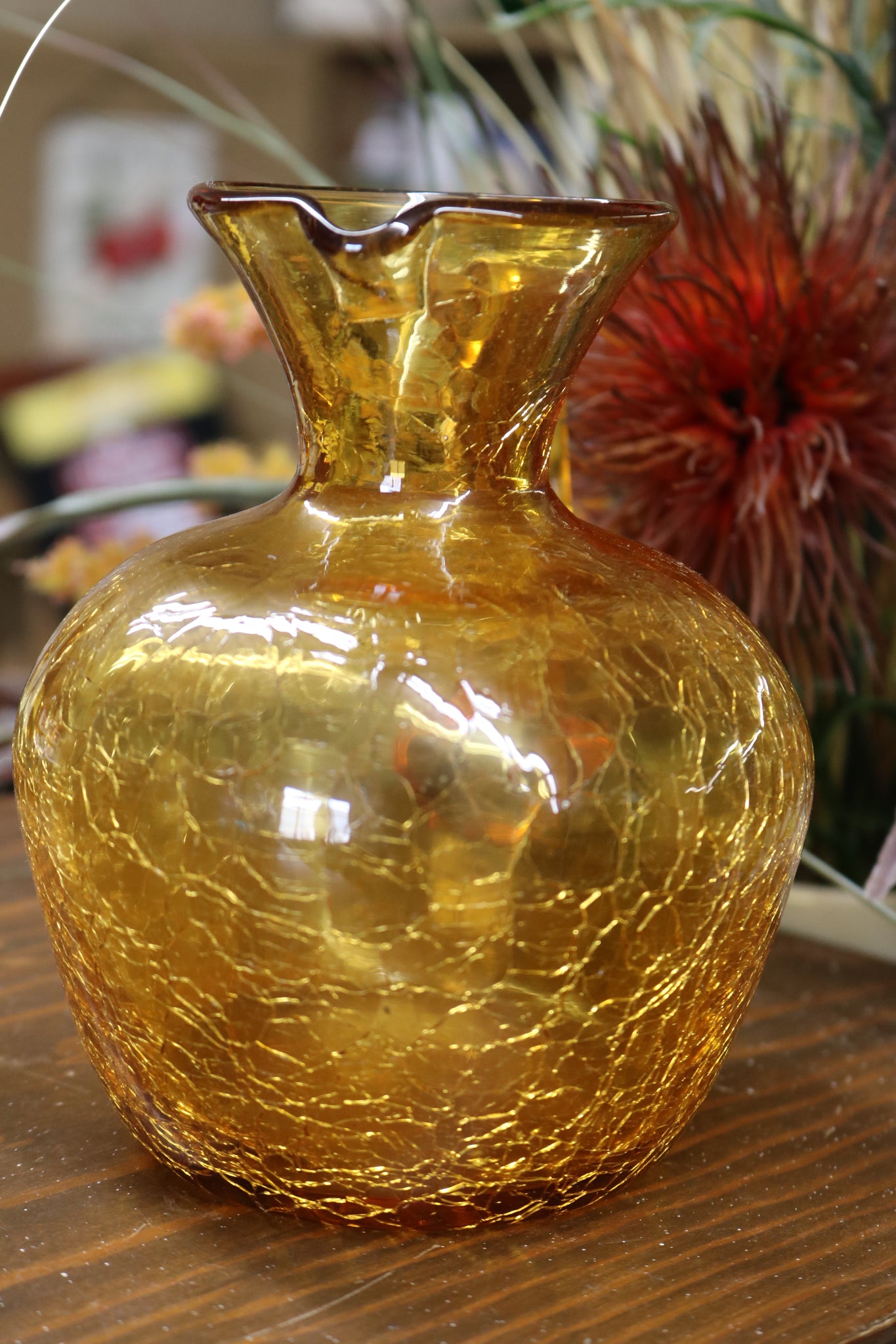 https://www.twovintagesisters.com/cdn/shop/products/Vintage-hand-blown-amber-crackle-glass-pitcher-6inch_7_1024x1024@2x.jpg?v=1630711688